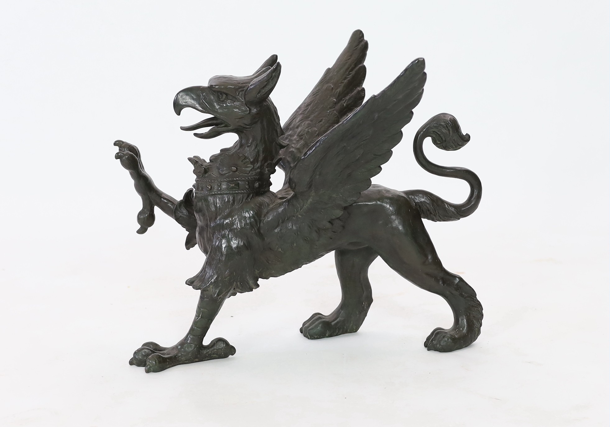 A 19th century bronze model of a griffon, length 58cm, height 45cm